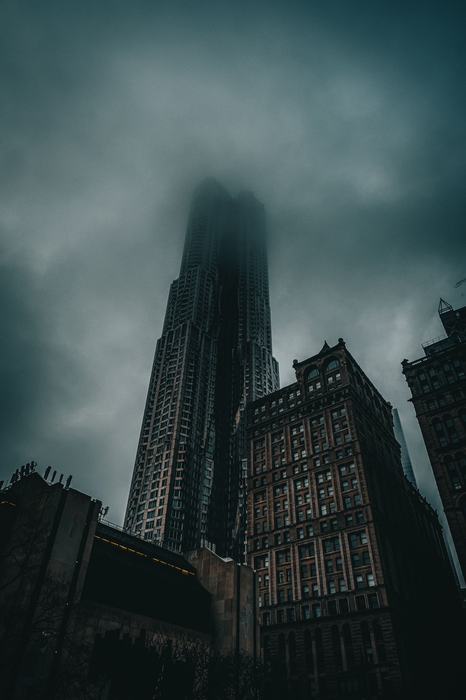 Tribeca skyscraper rising into fog over Manhattan
